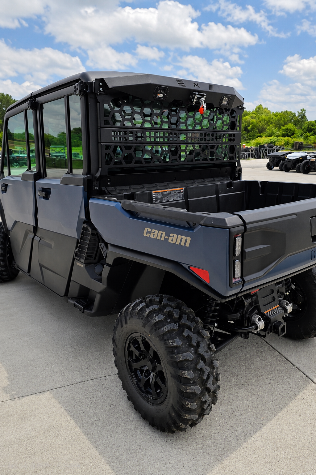 Can-Am Defender HD11 with No Limit Wheels Headache Rack and Game Loader installed behind the cab