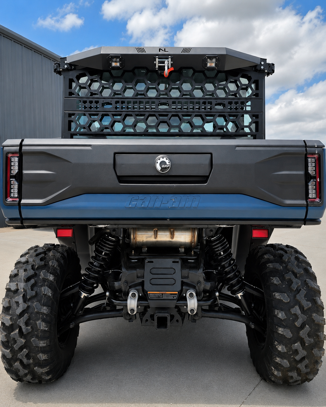 Rear view of Can-Am Defender HD11 with No Limit Wheels Headache Rack and Game Loader installed